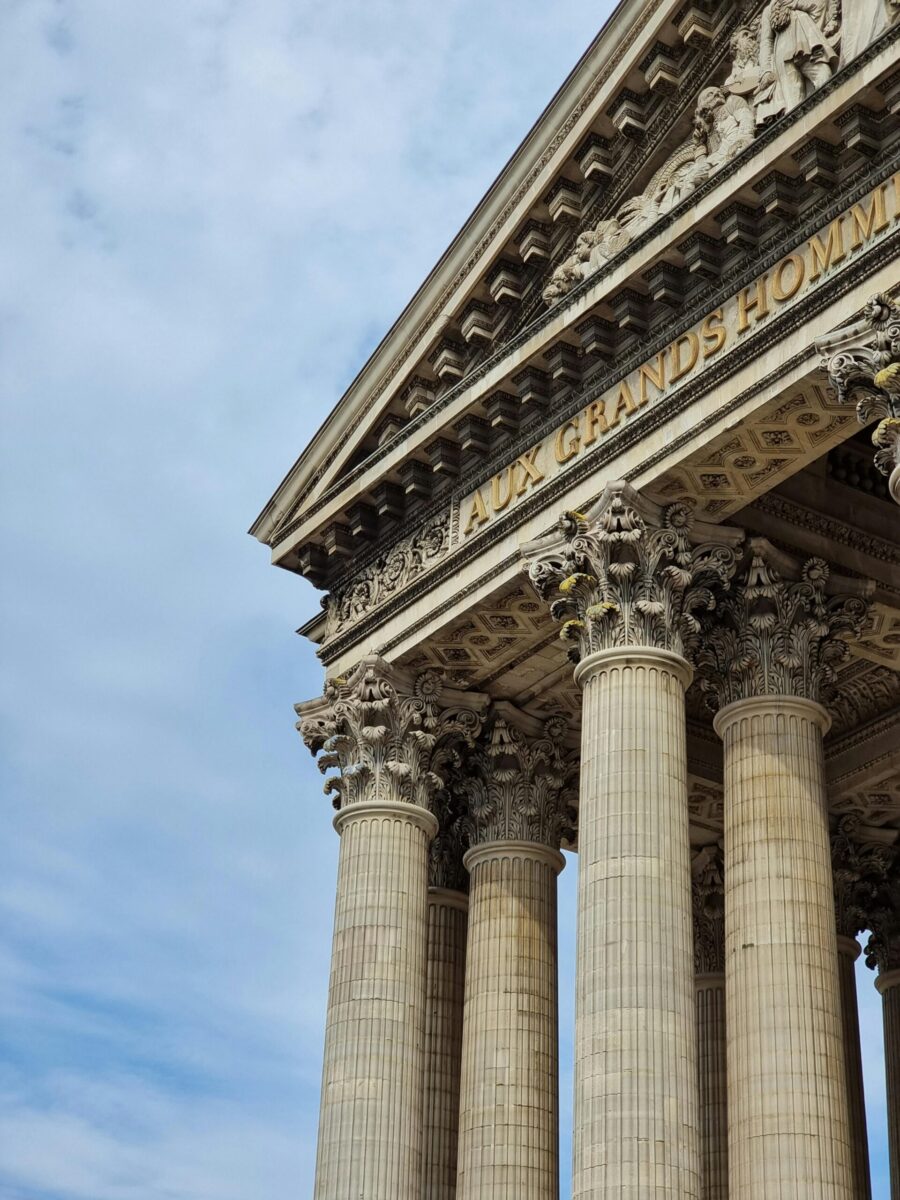Detailed view of the Pantheon in Paris showcasing its grand columns and architecture.